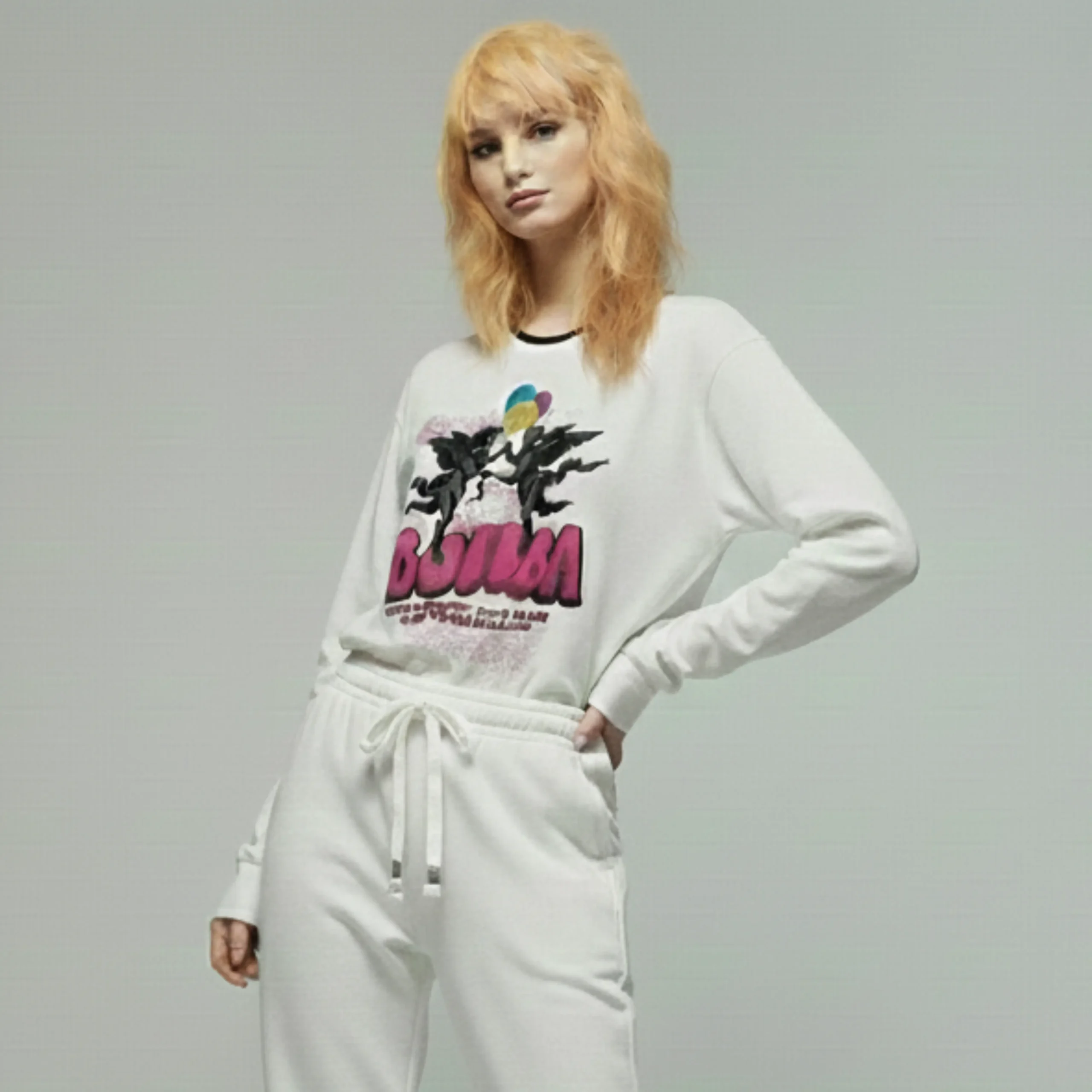 Women’s streetwear sweatshirt with pop-style angel graphics, balloon elements, and BOUM lettering; vibrant party-inspired design.