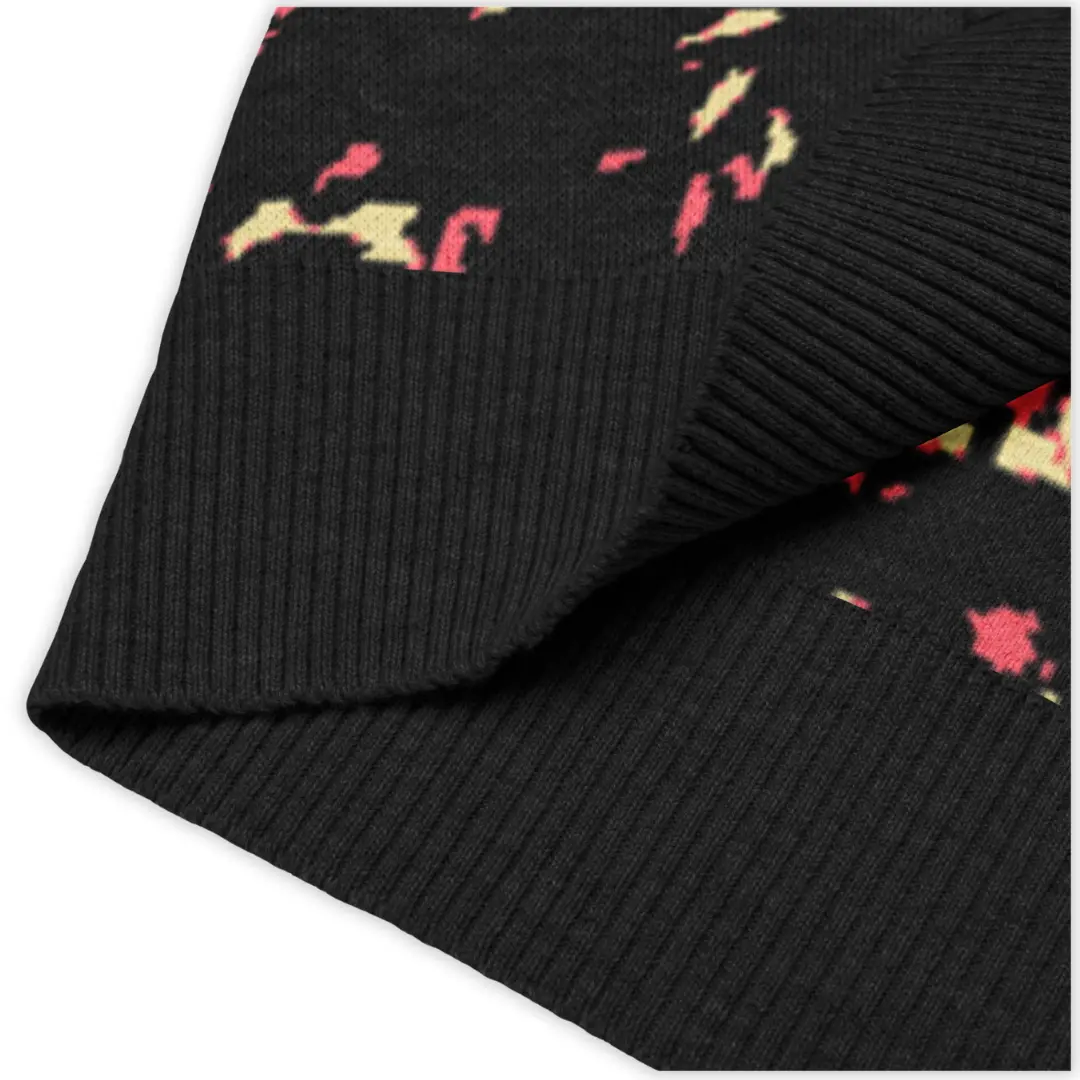 Men's knitted V-neck vest featuring an all-over Crystal Pink print. A bold and distinctive piece, perfect for a glam contemporary streetwear style.